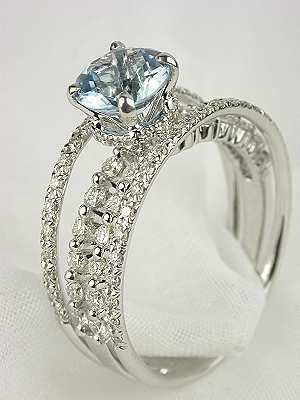 Like angels' wings this Gossamer aquamarine engagement ring lends a light 
