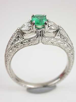 Emerald Engagement Ring with Heart Shaped Diamonds