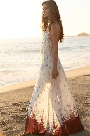 A beautiful girl on the beach at sunset. Styled by Christina Calautti for Topazery Jewelry.