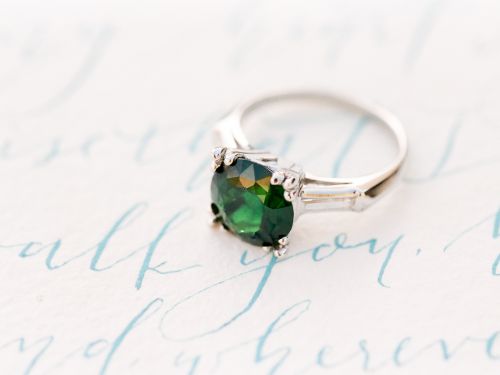 A Topazery vintage engagement ring with chrome tourmaline is one of the stars in a dreamy Hawaiian inspired wedding