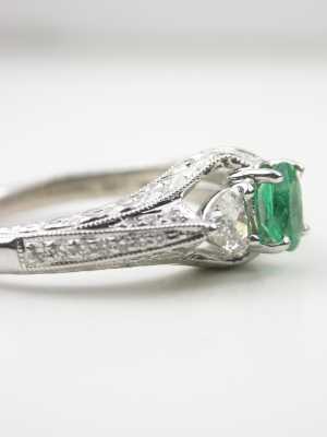Emerald Engagement Ring with Heart Shaped Diamonds